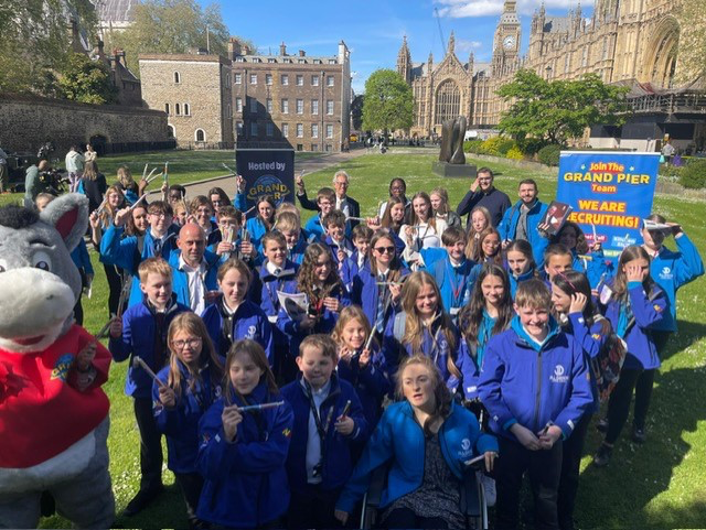 One of world’s best Grand Pier’s sponsors and surprises journalists on their trip to parliament